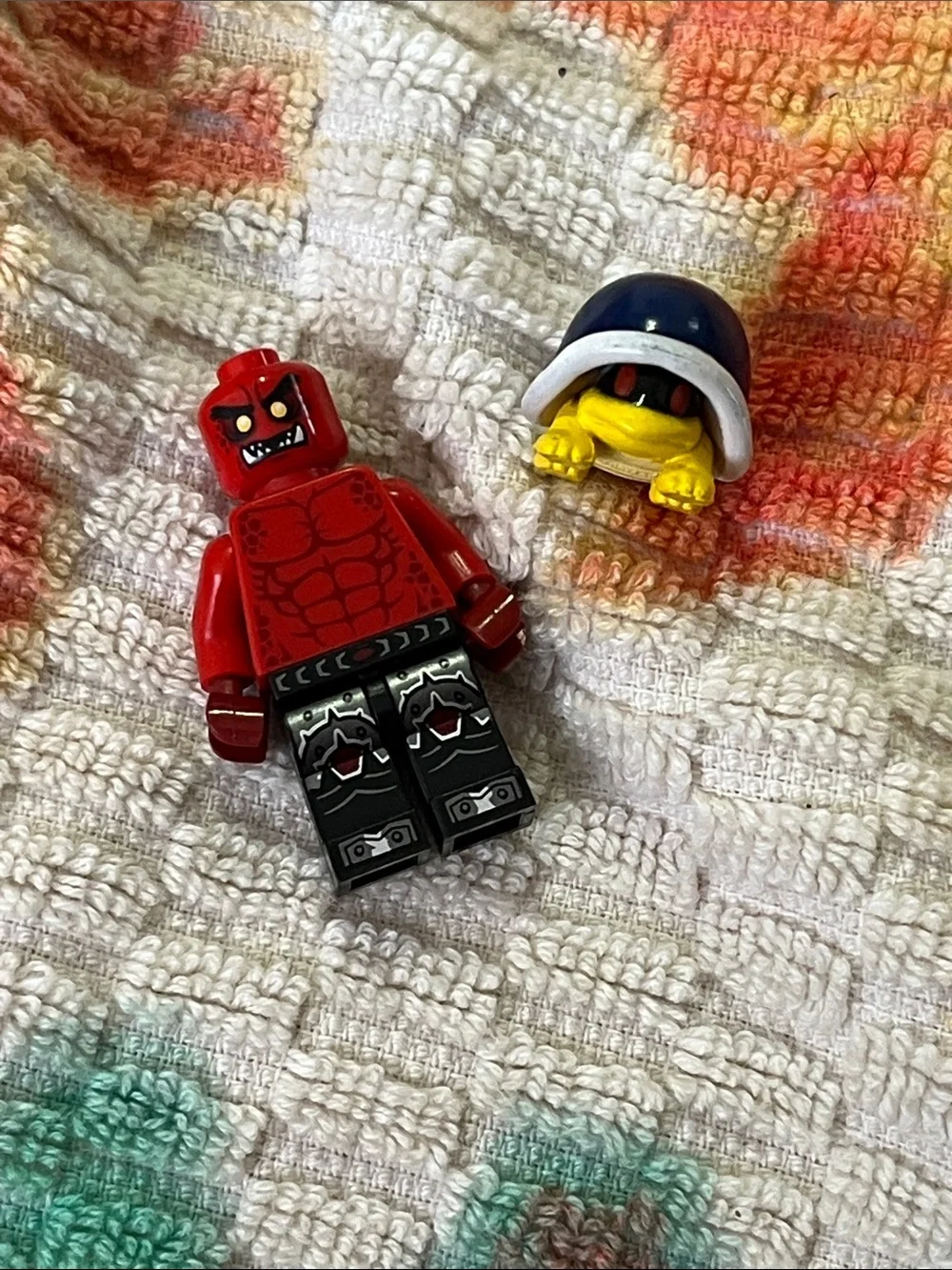 Lego Red Demon Minifigure with Black Printed Legs and Yellow Helmeted Accessory